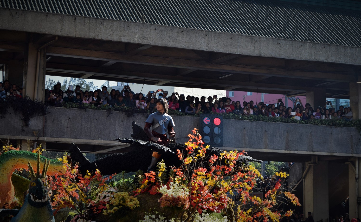 Man waves at crowd at Panagbenga flower festival 2015.