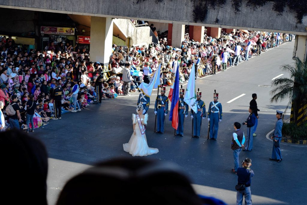 A local schools's cadet officers and their muse poses marches in front of the crowd at Panagbenga 2015.