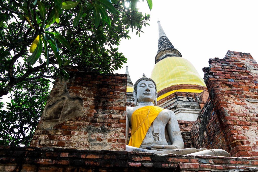 Buddha with Chedi in the Background